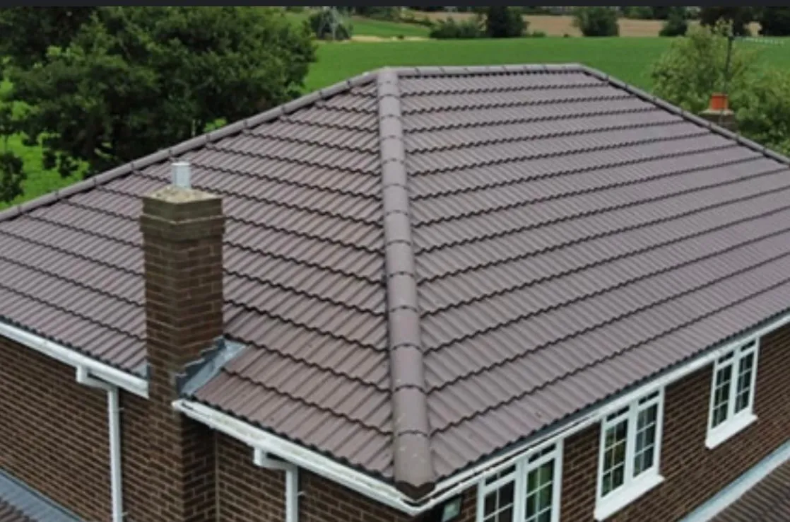 Completed pitched tile roof on a Birmingham home, installed by Cotsworld Roofing