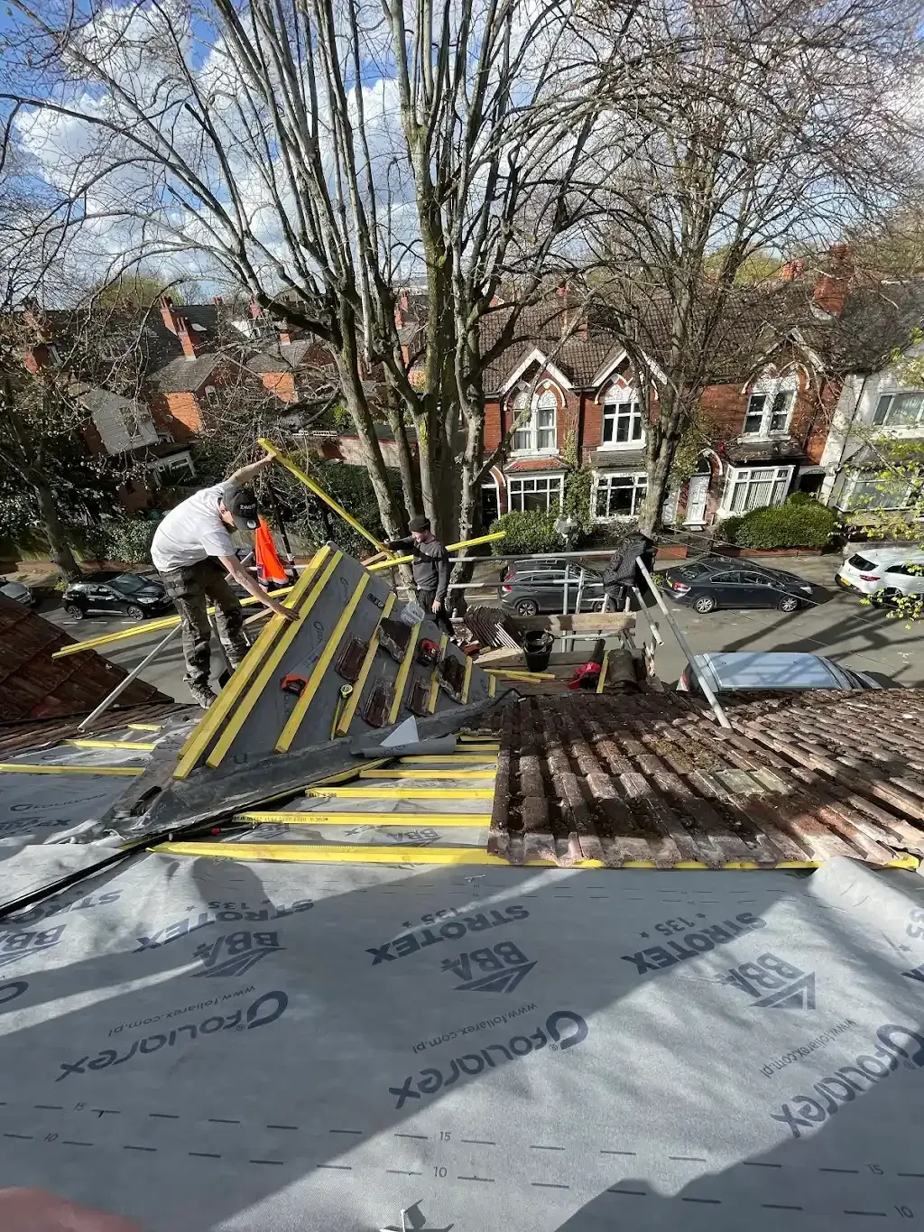 Cotsworld team re-roofing a suburban semi-detached property in Birmingham